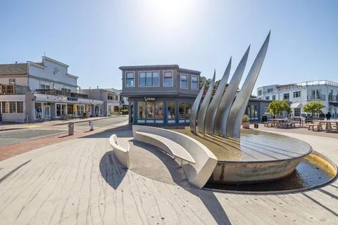 a view of swimming pool with outdoor seating