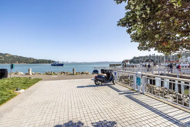 a view of a terrace with wooden floor and city view