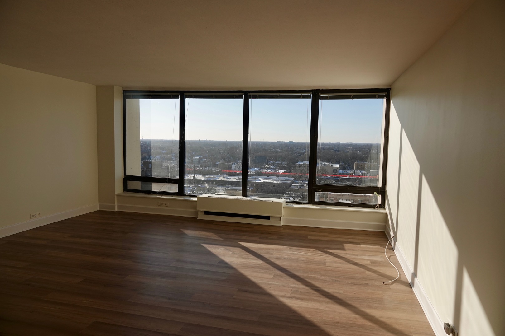 5445 North Sheridan Road, Unit 1603 Chicago, IL 60640 - Photo 19 of 40 a view of an empty room with a large window