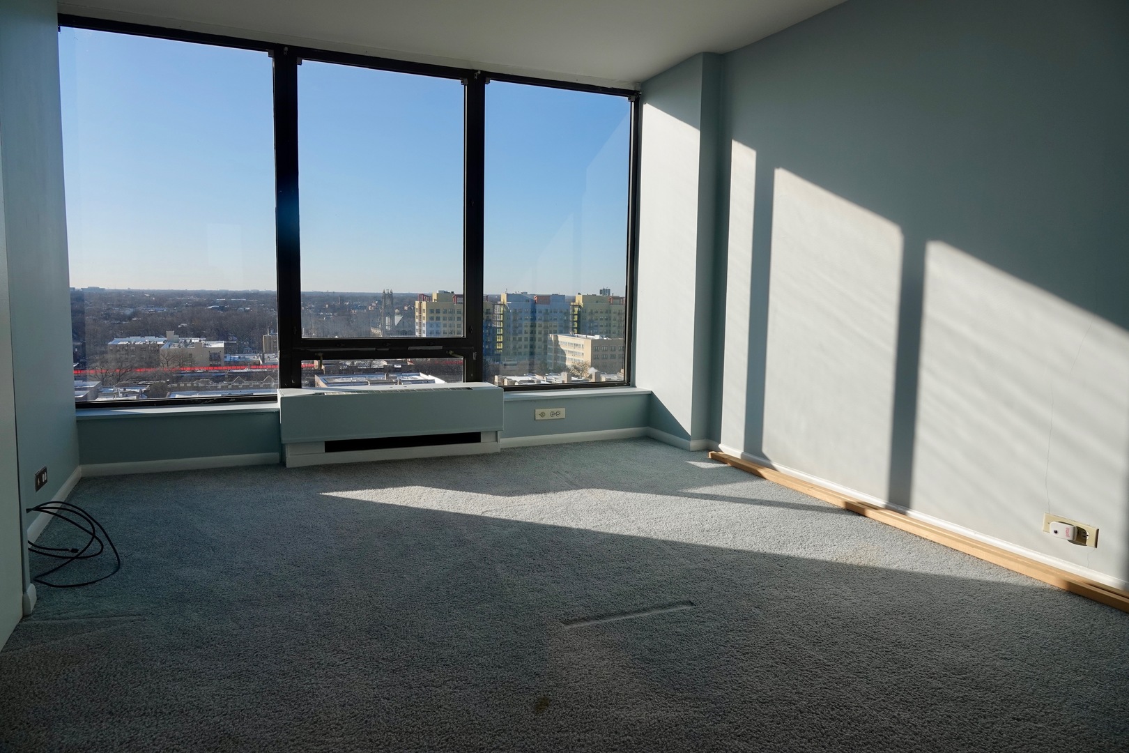 5445 North Sheridan Road, Unit 1603 Chicago, IL 60640 - Photo 22 of 40 a view of an empty room with a floor to ceiling window
