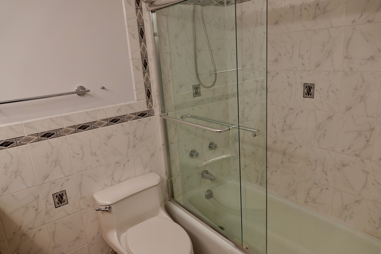 5445 North Sheridan Road, Unit 1603 Chicago, IL 60640 - Photo 38 of 40 a bathroom with a toilet and a shower