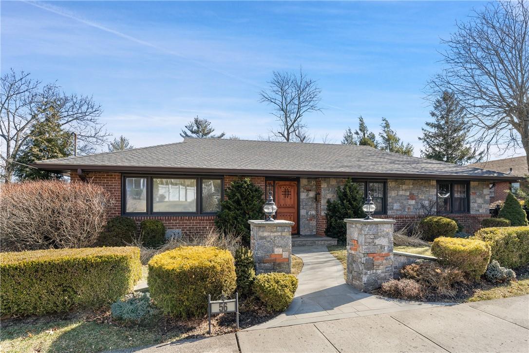 72 Carver Terrace Yonkers, NY 10710 - Photo 1 of 1 a front view of a house with garden