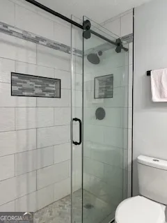 a view of a field with a tree in the background