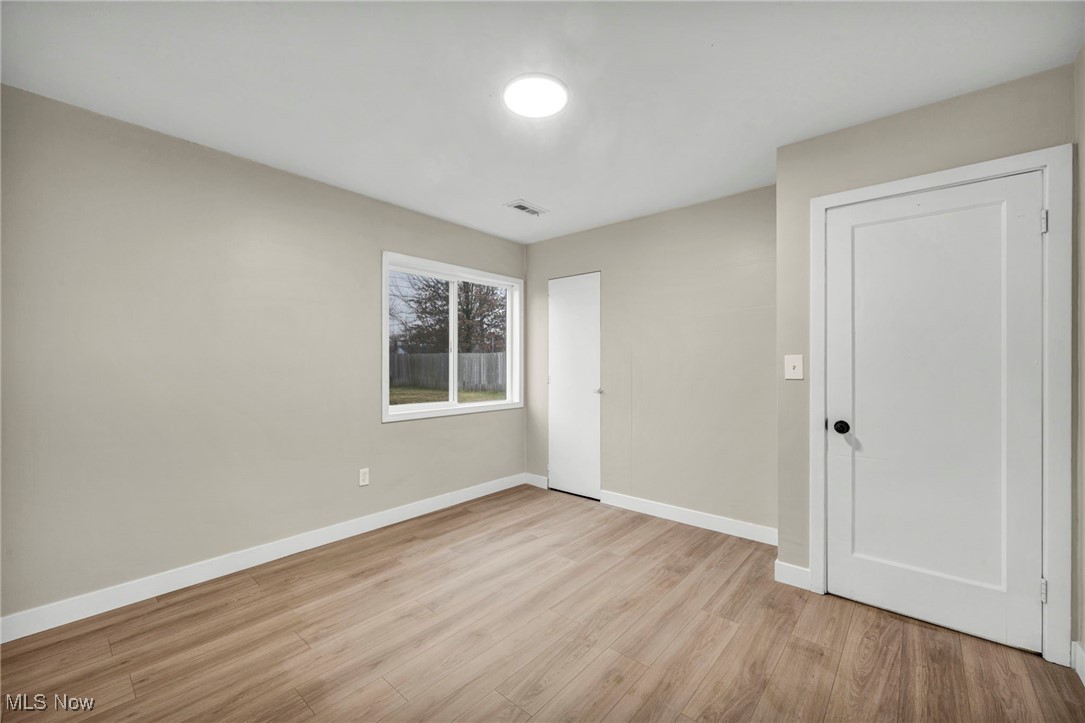 614 Weller Road Elyria, OH 44035 - Photo 29 of 39 Unfurnished bedroom with baseboards and light wood-style flooring