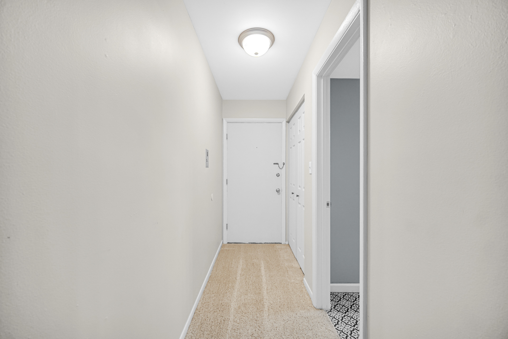 1320 Lore Lane, Unit 107B Lombard, IL 60148 - Photo 11 of 48 a view of a hallway with wooden floor