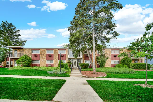 a front view of a building with garden
