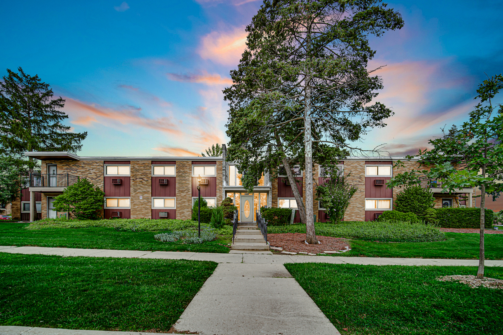 1320 Lore Lane, Unit 107B Lombard, IL 60148 - Photo 2 of 48 a front view of a house with garden