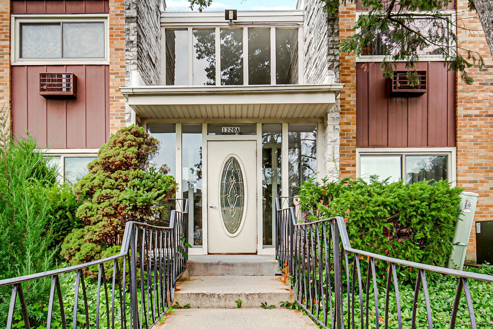 1320 Lore Lane, Unit 107B Lombard, IL 60148 - Photo 23 of 48 a view of a house with a window and wooden fence