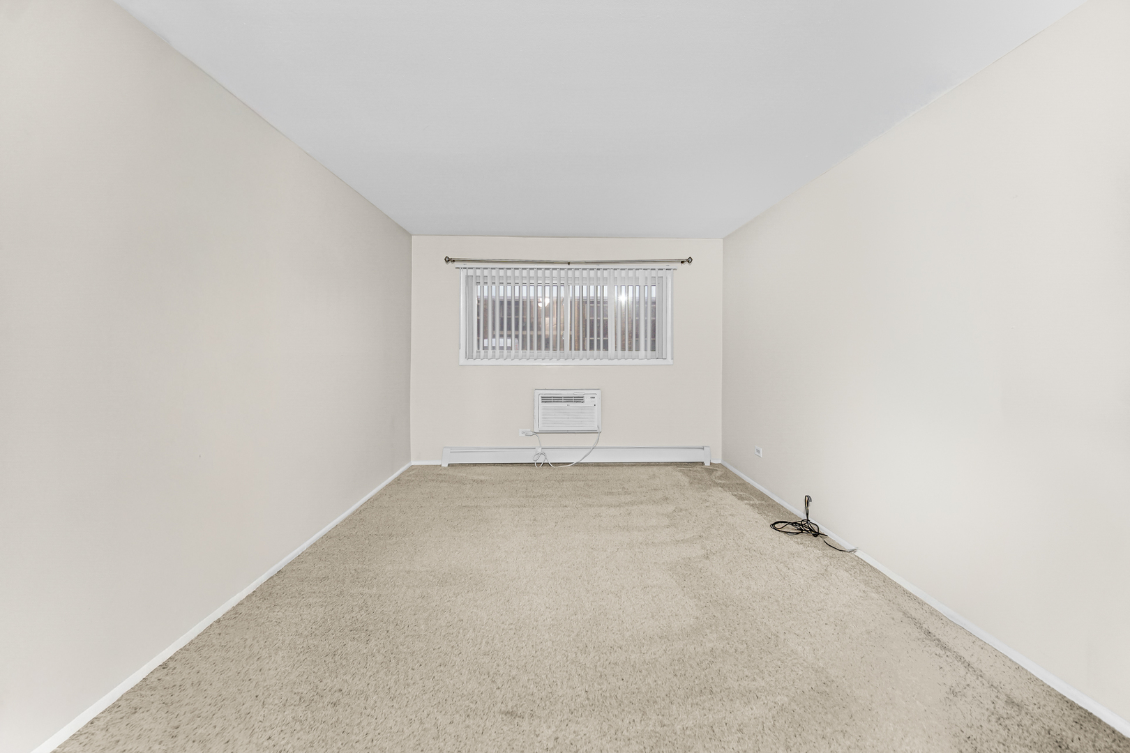 1320 Lore Lane, Unit 107B Lombard, IL 60148 - Photo 29 of 48 an empty room with a window