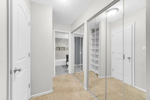 a bathroom with a glass shower door