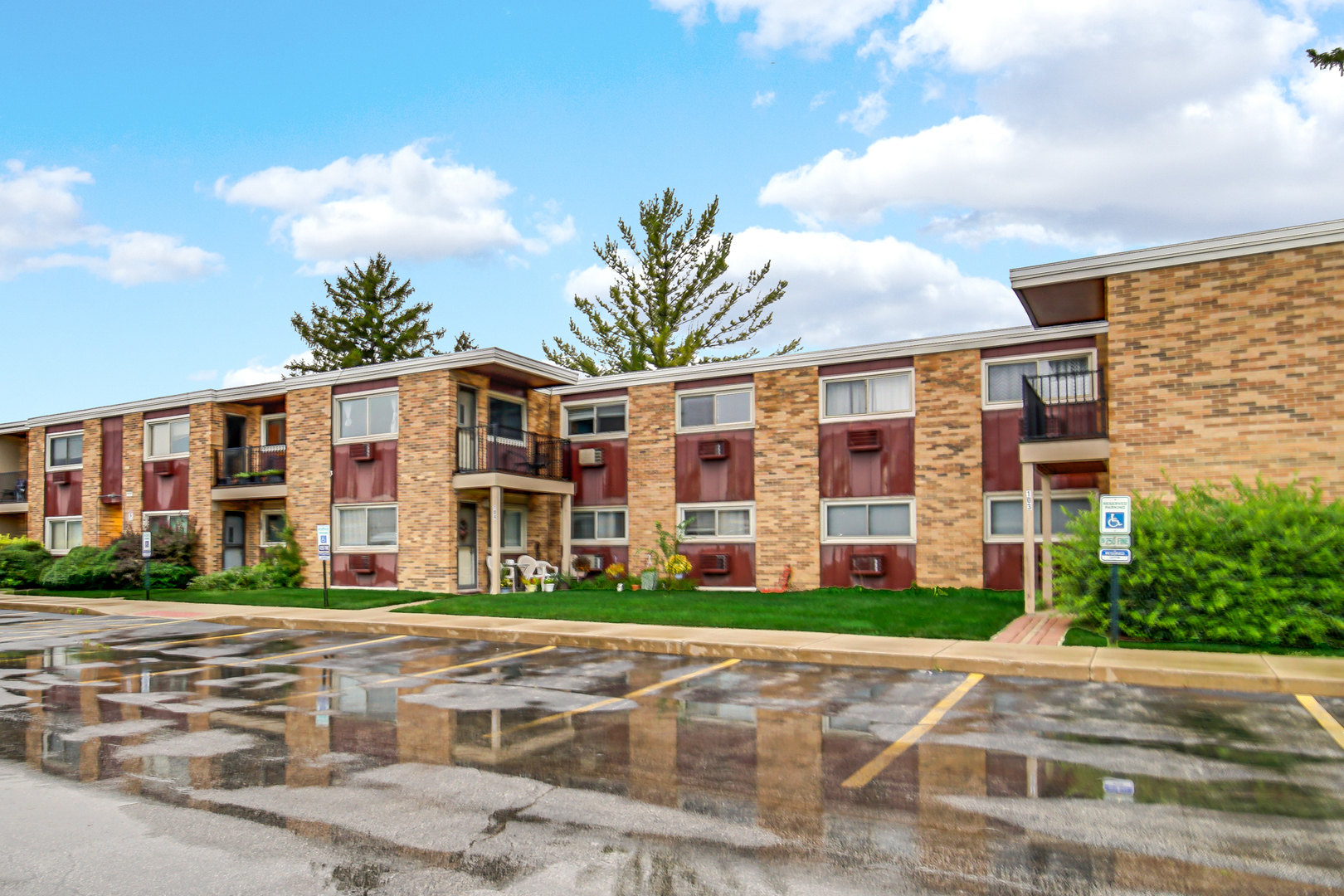 1320 Lore Lane, Unit 107B Lombard, IL 60148 - Photo 38 of 48 a front view of building with yard