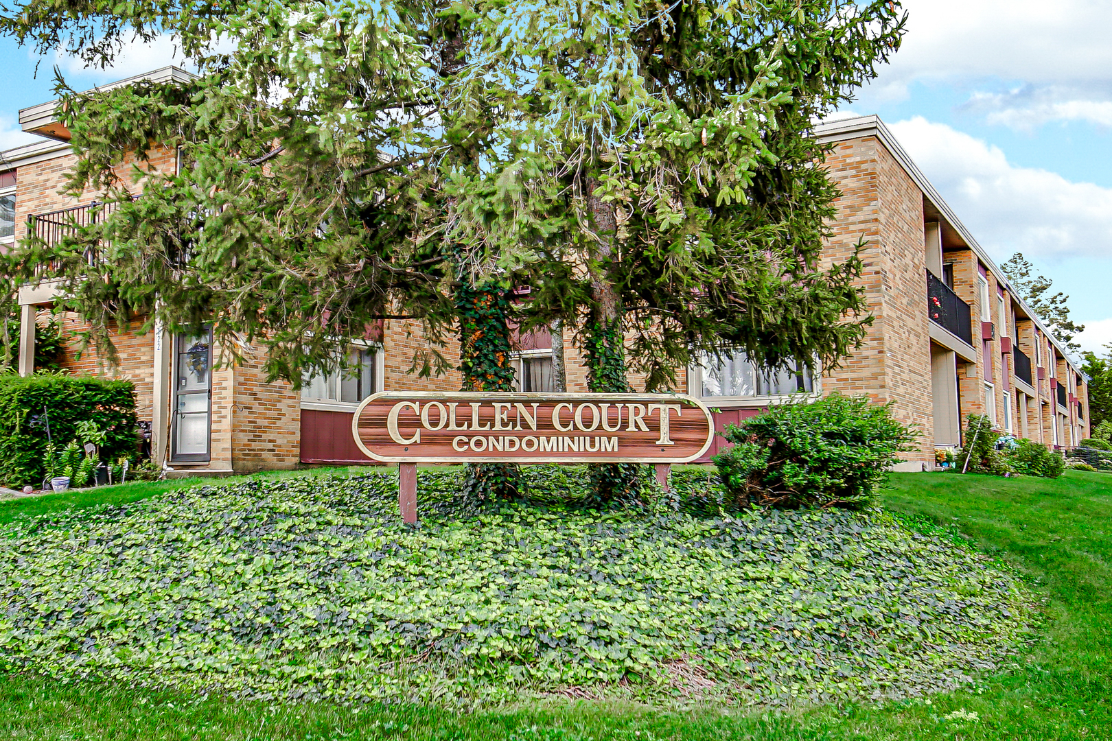 1320 Lore Lane, Unit 107B Lombard, IL 60148 - Photo 40 of 48 a sign on the side of the building