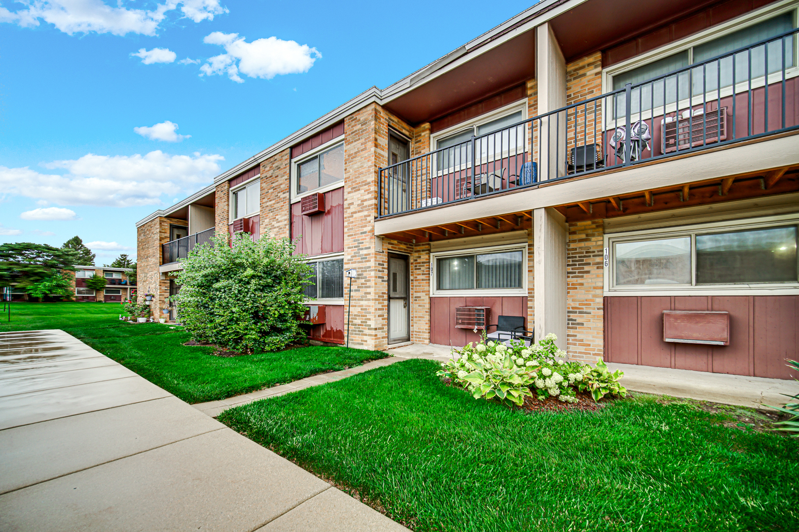 1320 Lore Lane, Unit 107B Lombard, IL 60148 - Photo 44 of 48 a front view of a building with a garden