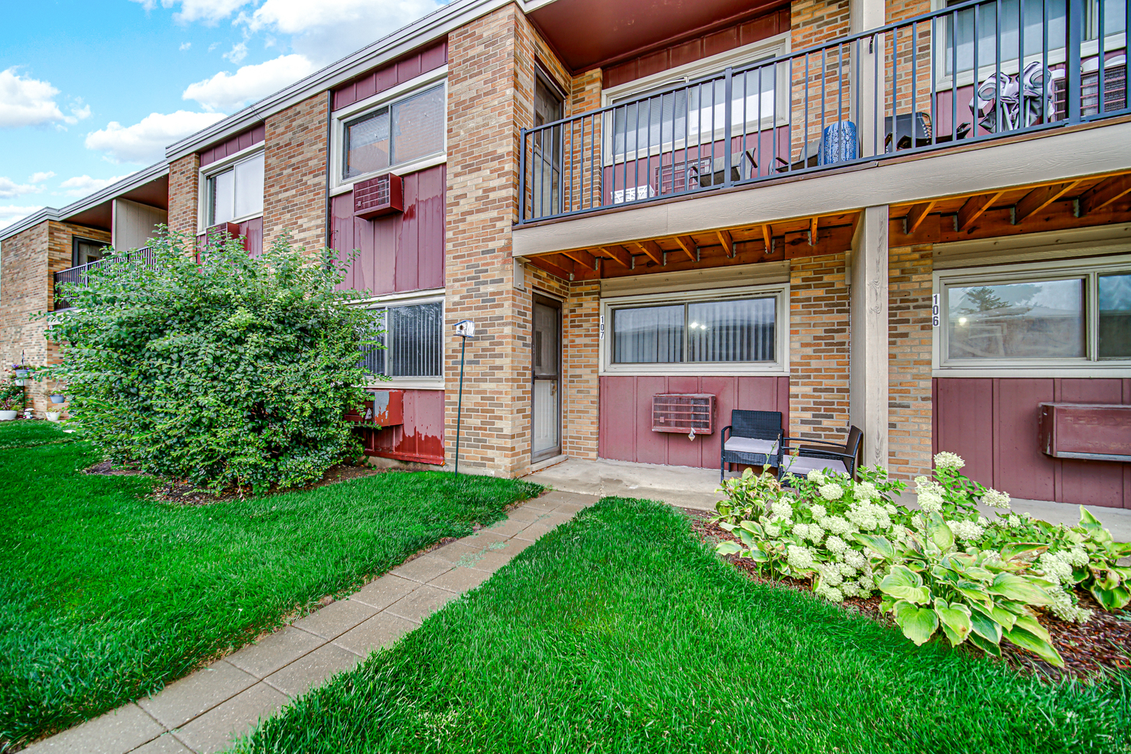 1320 Lore Lane, Unit 107B Lombard, IL 60148 - Photo 48 of 48 a front view of a building with garden