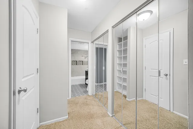 a bathroom with a glass shower door