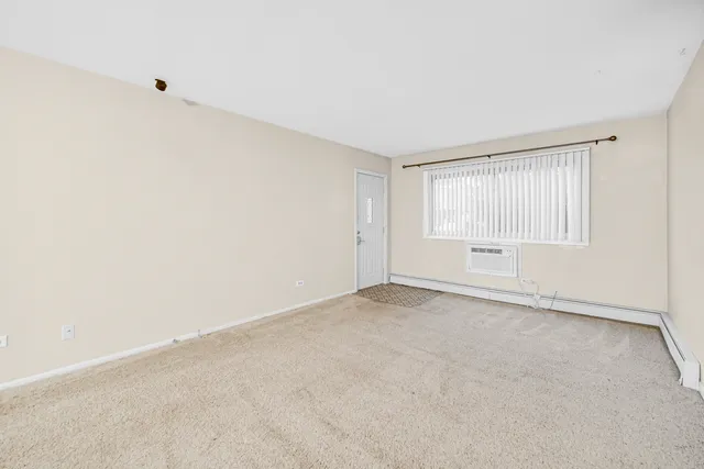 an empty room with a empty space and windows