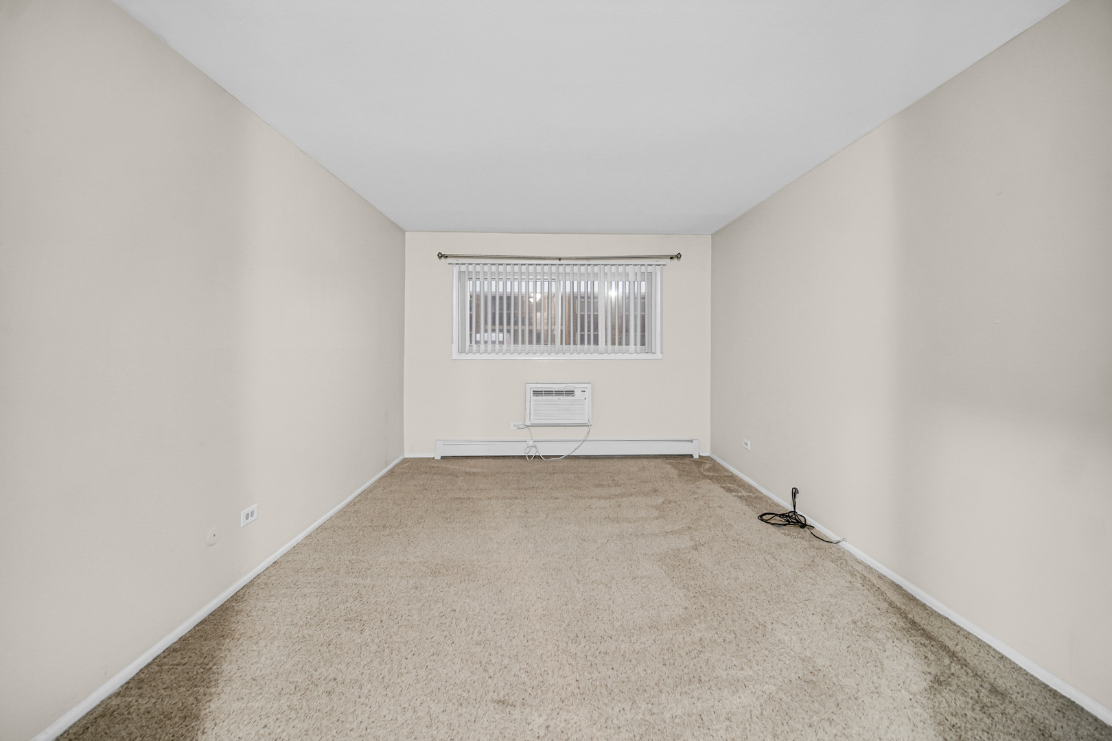 1320 Lore Lane, Unit 107B Lombard, IL 60148 - Photo 10 of 48 an empty room with a window