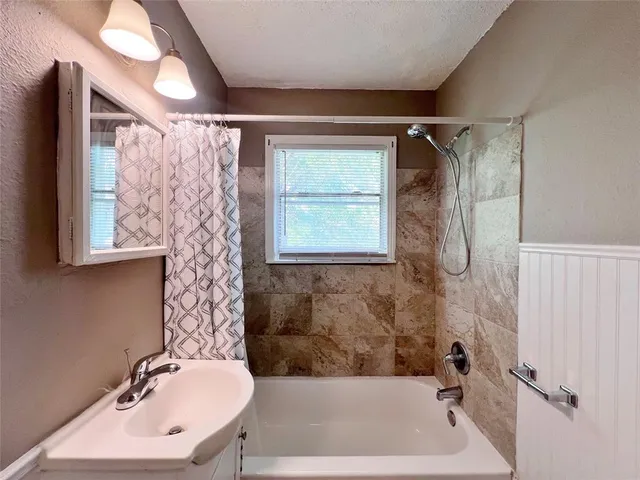 a bathroom with a sink and a bathtub