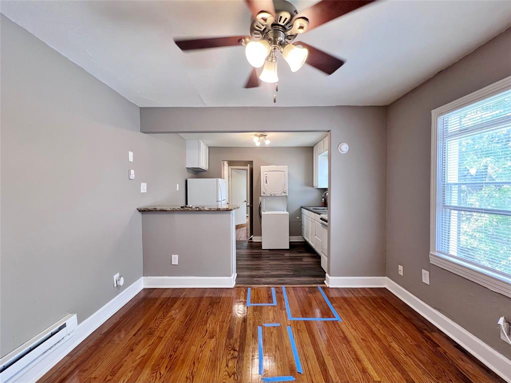 1121 North Bishop Avenue, Unit C Dallas, TX 75208 - Photo 5 of 11 a view of a room with wooden floor and staircase