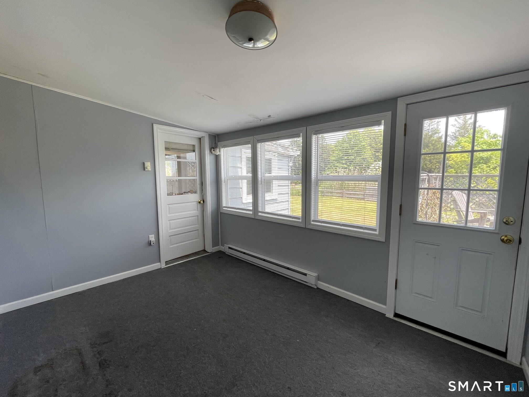 18 Old South Cove Road Old Saybrook, CT 06475 - Photo 23 of 40 an empty room with windows