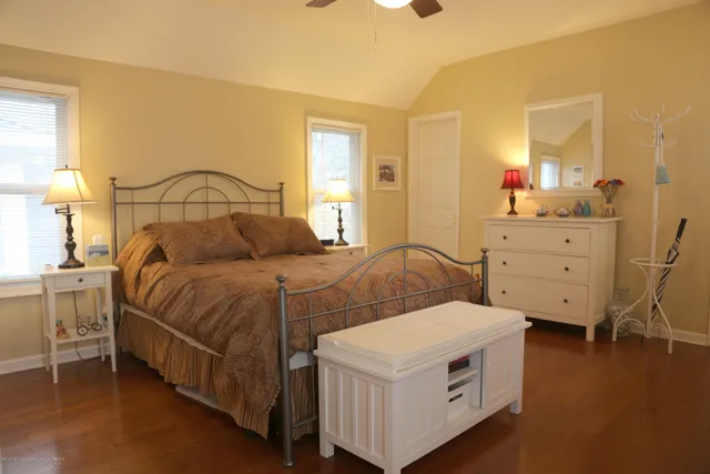 a bedroom with a bed and a dresser