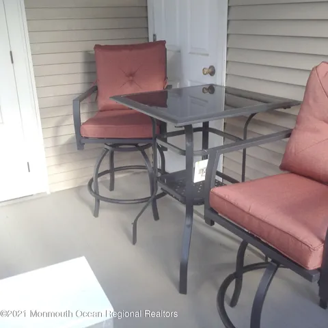 a room with furniture and a potted plant