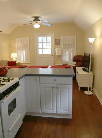 a kitchen with a stove a sink and a refrigerator