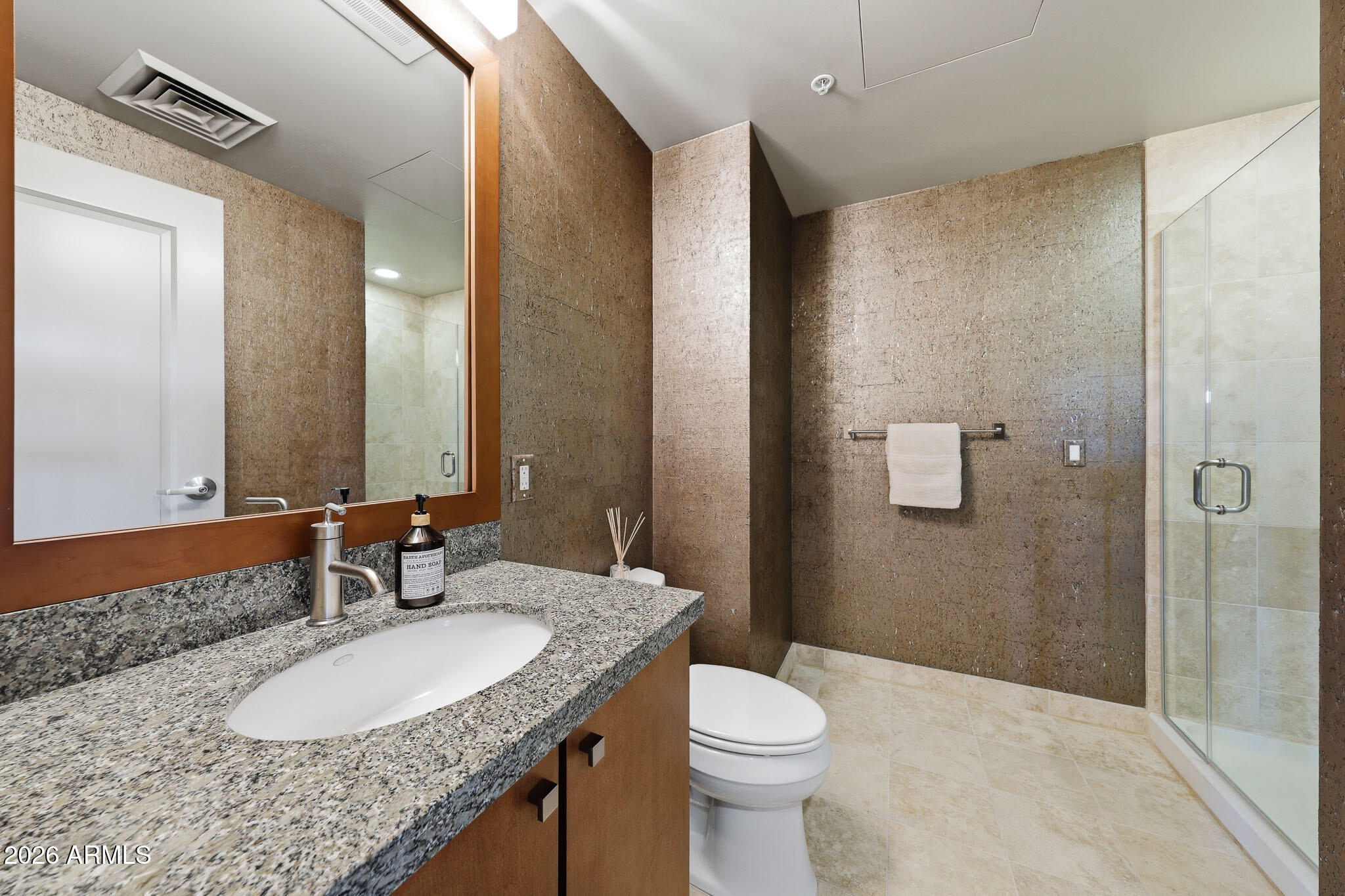 310 South 4th Street, Unit 2204 Phoenix, AZ 85004 - Photo 15 of 66 a bathroom with a granite countertop sink and a mirror
