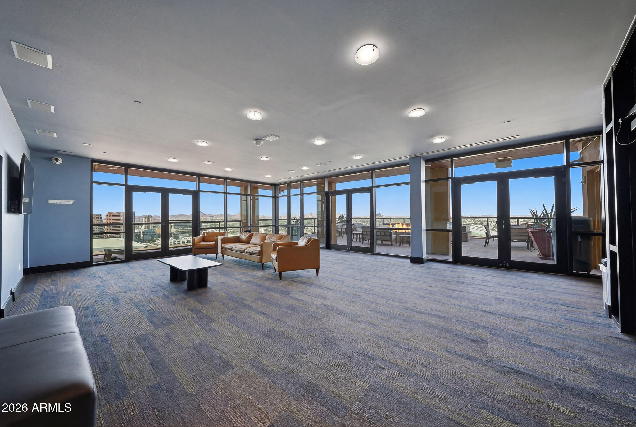 310 South 4th Street, Unit 2204 Phoenix, AZ 85004 - Photo 47 of 66 a view of a room with gym equipment and a large window