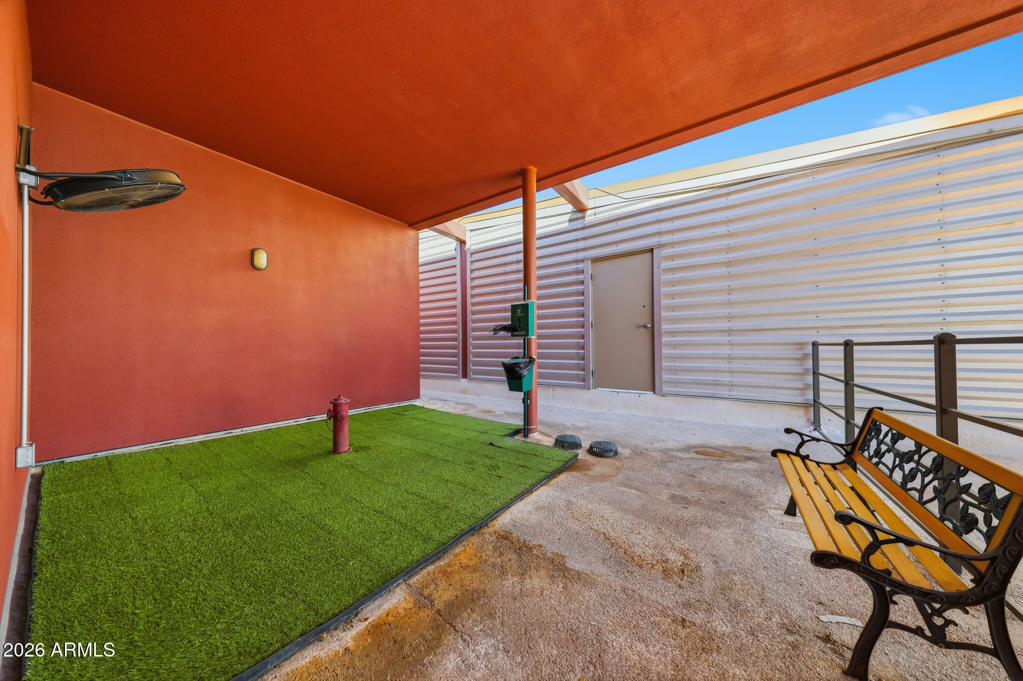 310 South 4th Street, Unit 2204 Phoenix, AZ 85004 - Photo 55 of 66 a backyard of a house with table and chairs