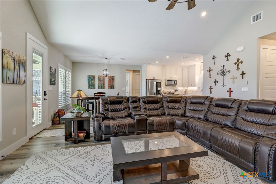 281 Cibolo Way La Vernia, TX 78121 - Photo 12 of 47 a living room with lots of furniture and kitchen view
