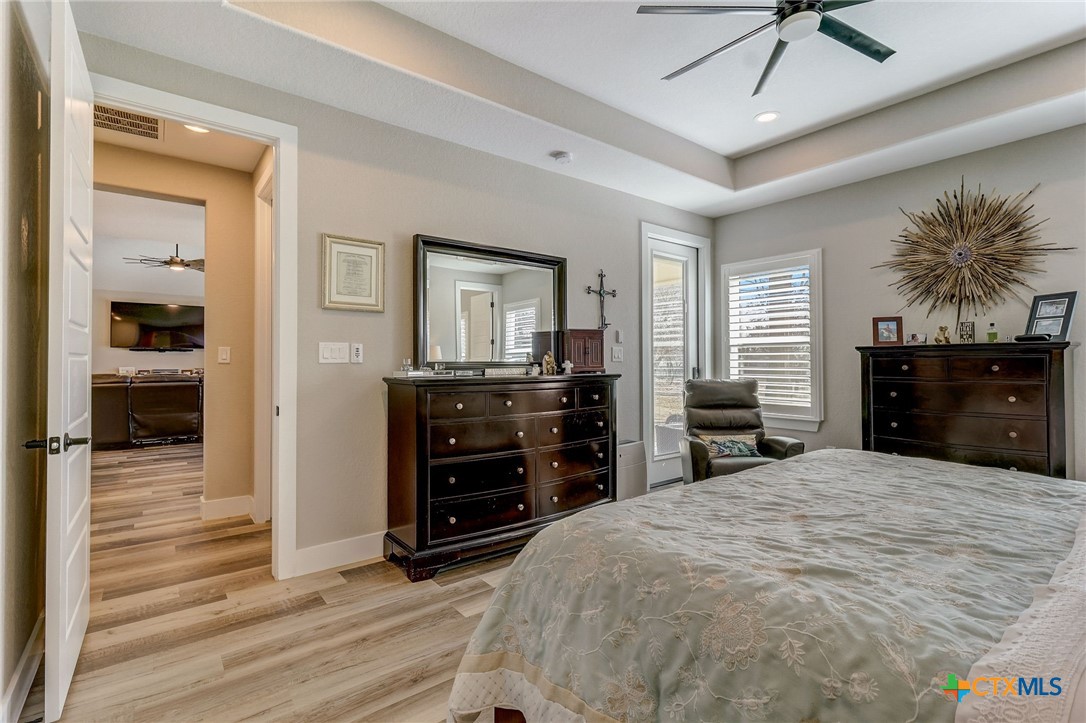 281 Cibolo Way La Vernia, TX 78121 - Photo 19 of 47 a large bedroom with a bed and a dresser