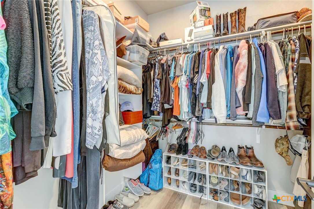 281 Cibolo Way La Vernia, TX 78121 - Photo 24 of 47 a view of walk in closet with clothes and shoes