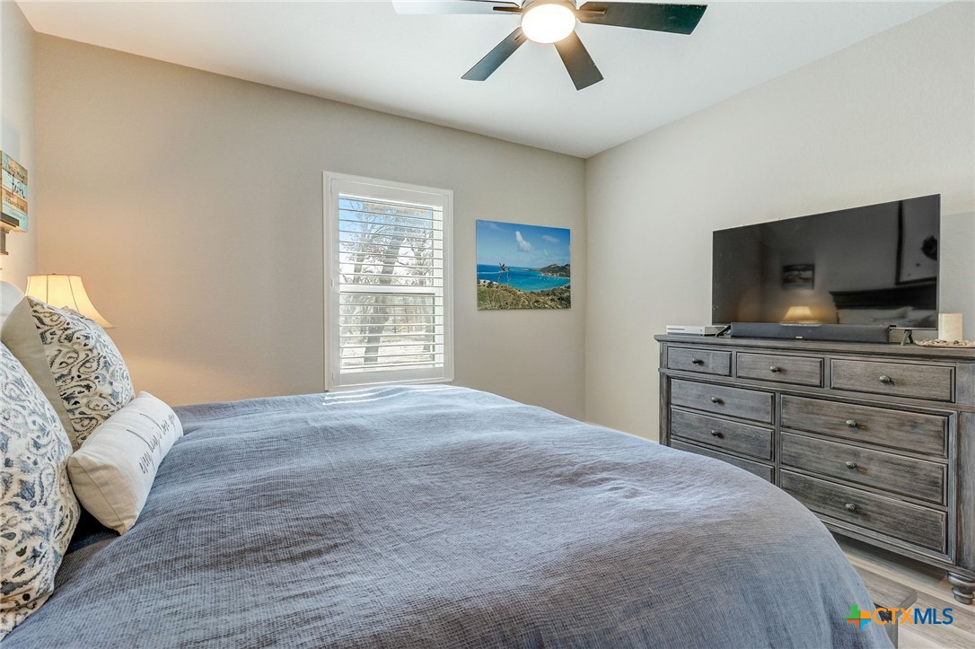 281 Cibolo Way La Vernia, TX 78121 - Photo 29 of 47 a bedroom with a bed and a flat screen tv