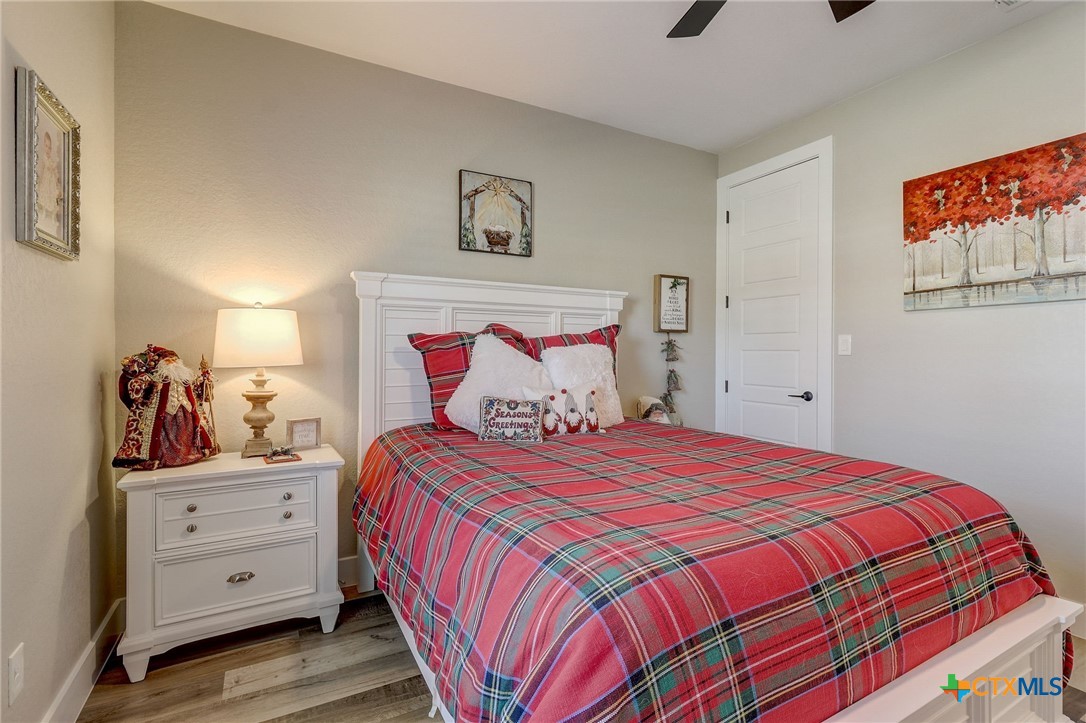 281 Cibolo Way La Vernia, TX 78121 - Photo 35 of 47 a bedroom with a bed and a cabinets