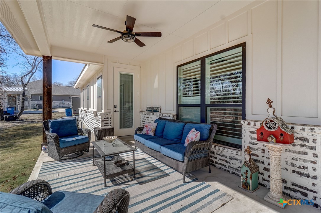 281 Cibolo Way La Vernia, TX 78121 - Photo 36 of 47 a living room with furniture a rug and a window