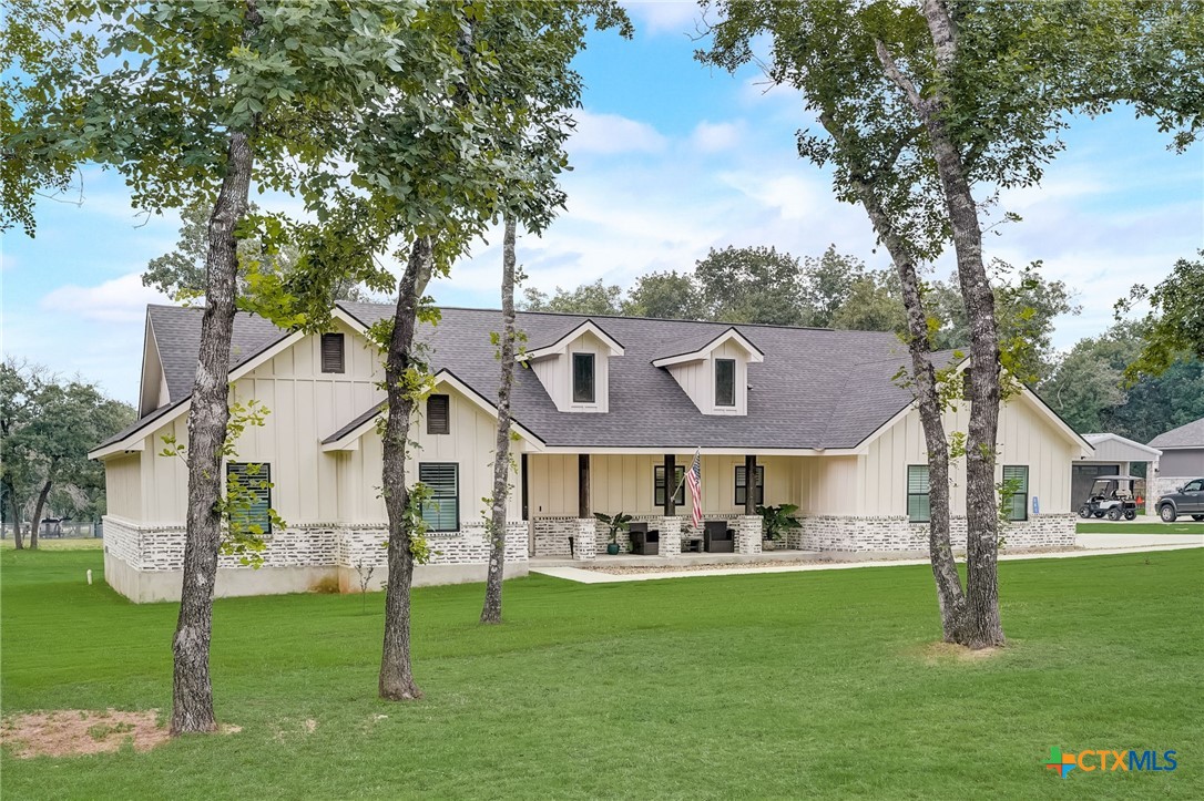 281 Cibolo Way La Vernia, TX 78121 - Photo 4 of 47 a front view of a house with a garden and yard