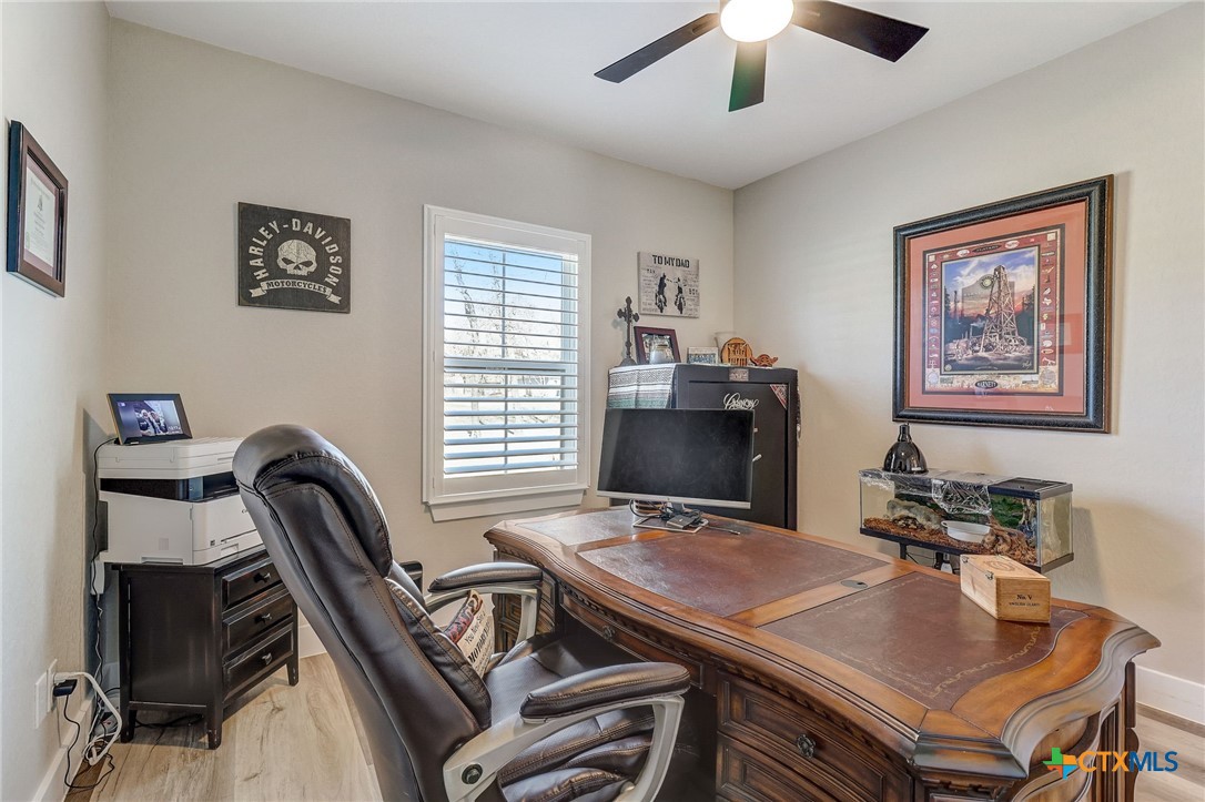 281 Cibolo Way La Vernia, TX 78121 - Photo 8 of 47 a view of a workspace with furniture and a window