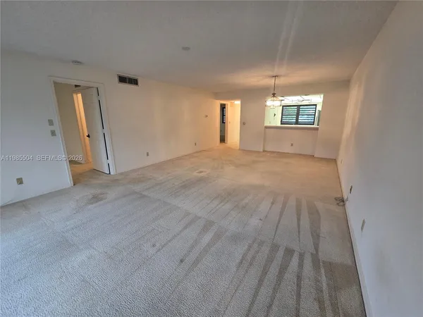 a view of empty room with windows