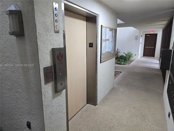 a view of a hallway with a elevator