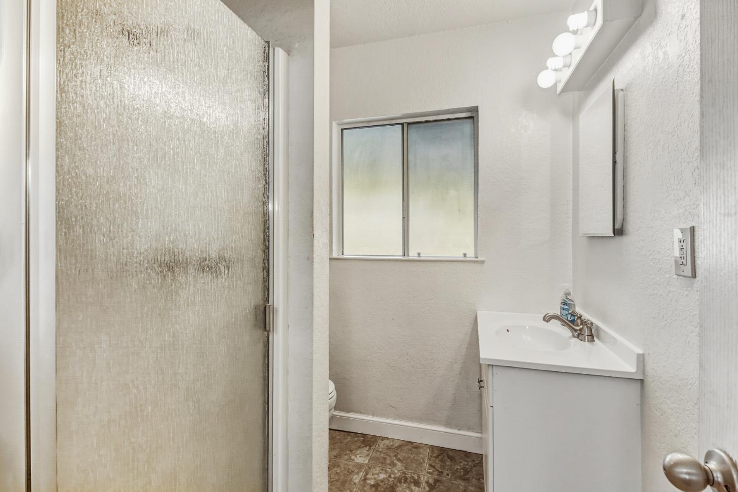 3140 Brennans Road Loomis, CA 95650 - Photo 12 of 45 a bathroom with a sink and mirror