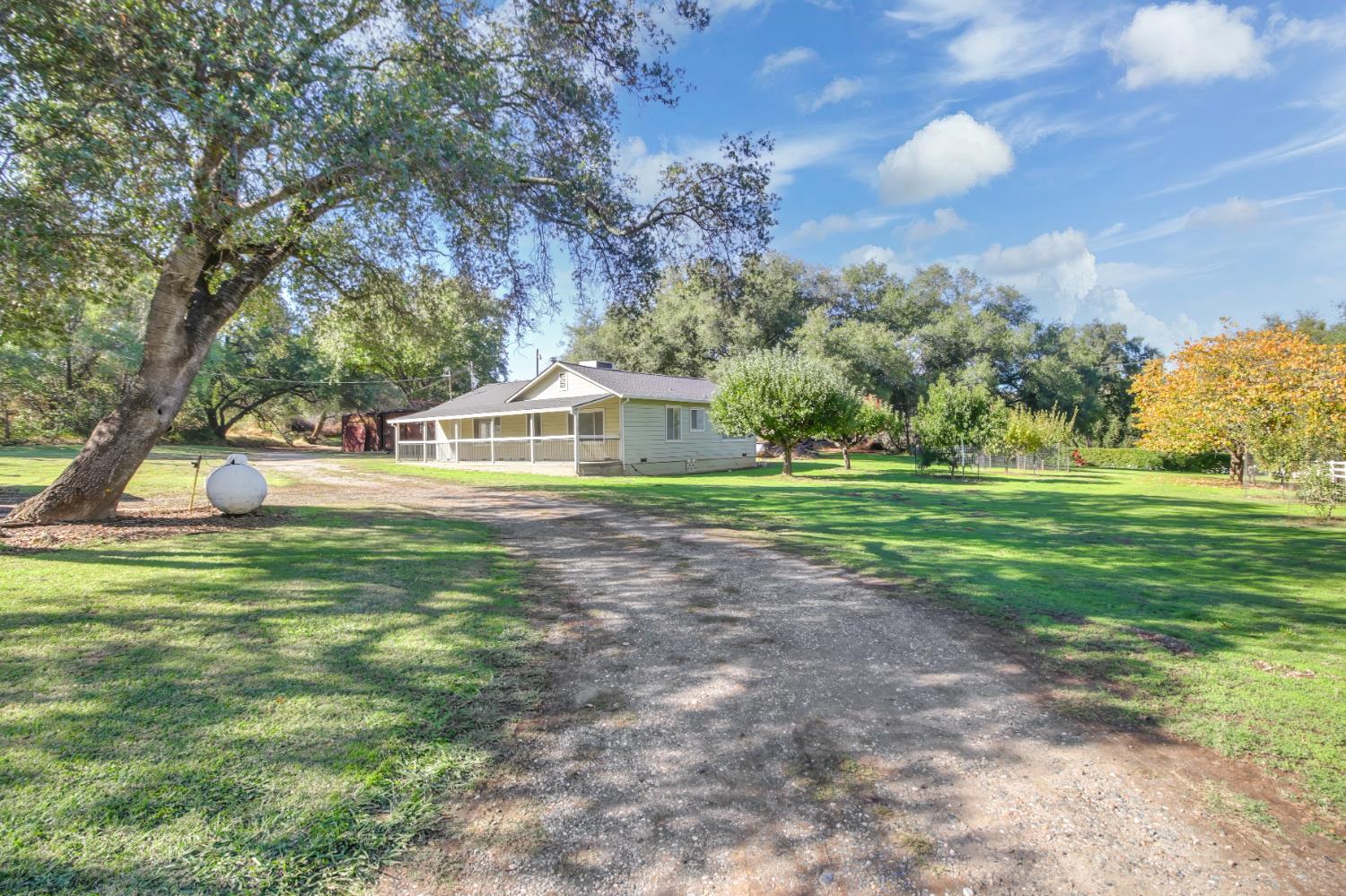 3140 Brennans Road Loomis, CA 95650 - Photo 27 of 45 a front view of a house with a yard