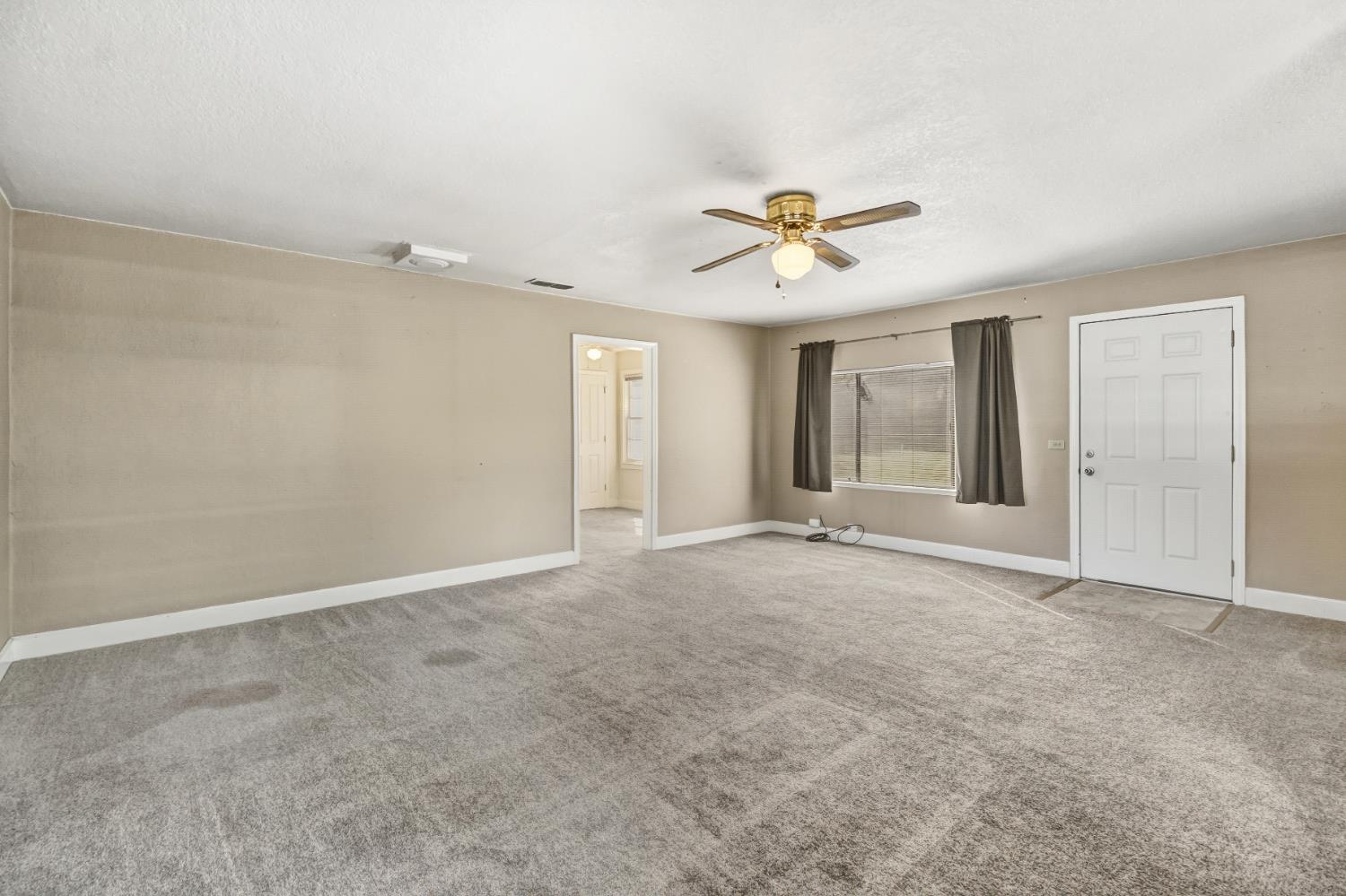 3140 Brennans Road Loomis, CA 95650 - Photo 4 of 45 a view of an empty room with a ceiling fan