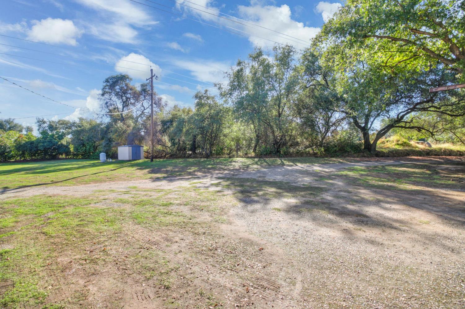 3140 Brennans Road Loomis, CA 95650 - Photo 41 of 45 a view of a field with trees in the background