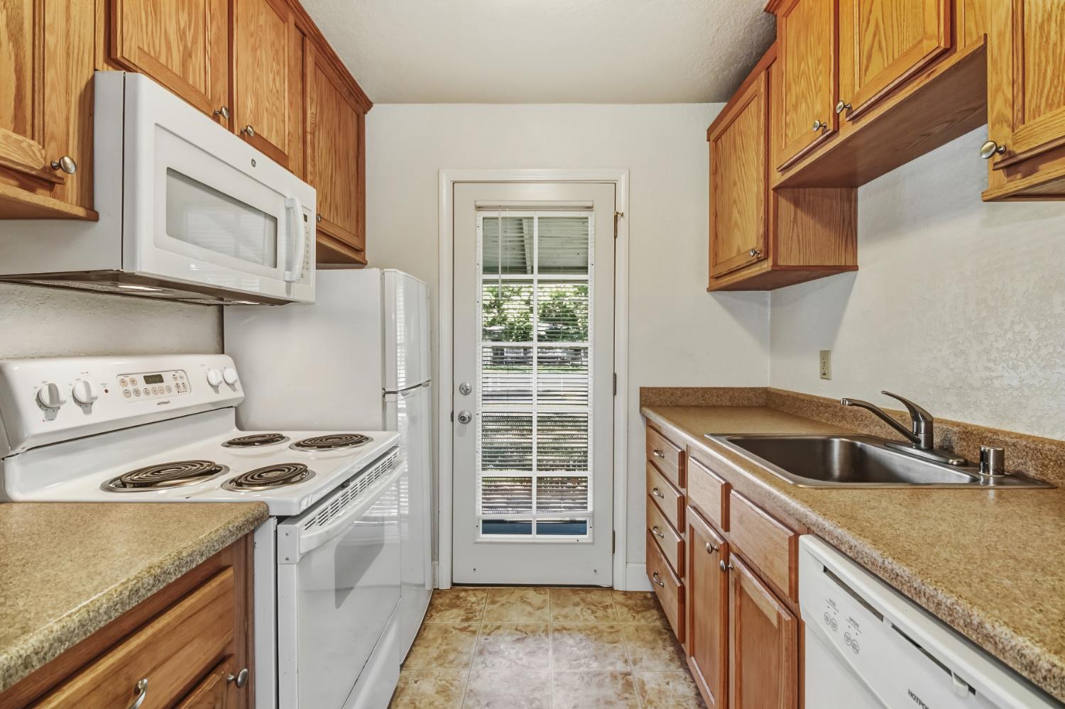 3140 Brennans Road Loomis, CA 95650 - Photo 9 of 45 a kitchen that has a sink and a stove