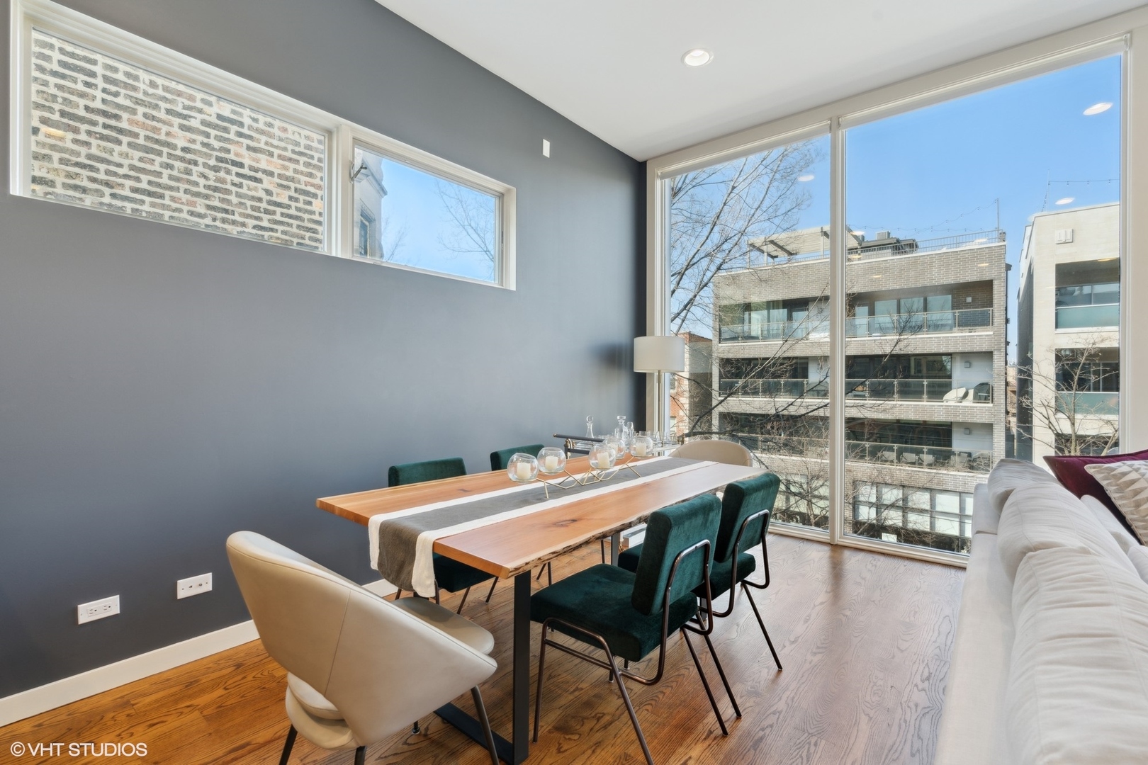 2207 West Chicago Avenue, Unit 3W Chicago, IL 60622 - Photo 3 of 15 a view of a dining room with furniture and wooden floor