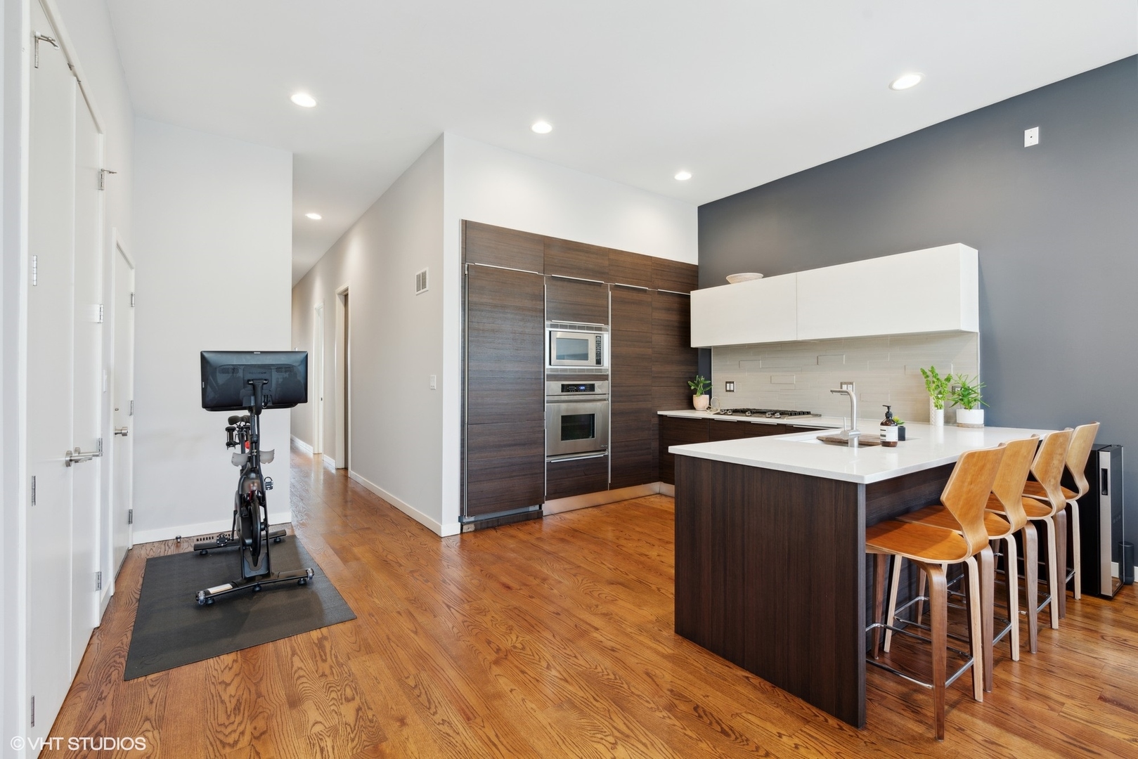 2207 West Chicago Avenue, Unit 3W Chicago, IL 60622 - Photo 5 of 15 a kitchen with kitchen island a stove and a refrigerator