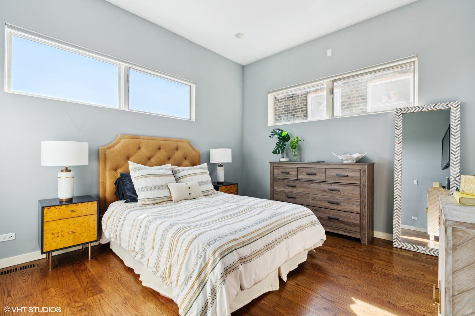 2207 West Chicago Avenue, Unit 3W Chicago, IL 60622 - Photo 6 of 15 a bedroom with a bed and a dresser