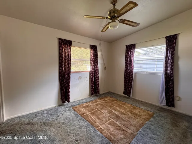 a view of a room with closet and wooden floor