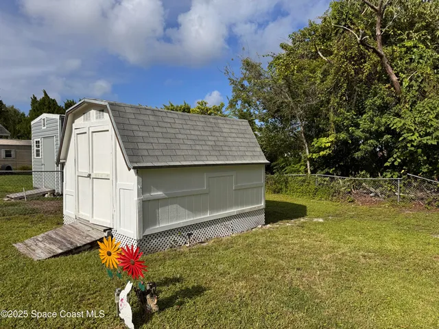 a view of a lake with houses in the back